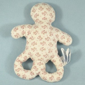 Hochet OBAIBI doudou bonhomme rose et blanc