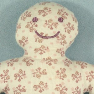 Hochet OBAIBI doudou bonhomme rose et blanc