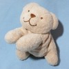 Ours TEX CARREFOUR doudou beige allongé
