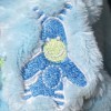 Ours TEX sos doudou beige vêtement bleu motif ane