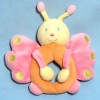 Papillon SUCRE D'ORGE doudou hochet rose et orange