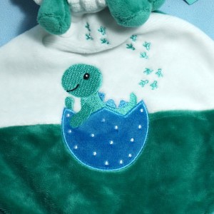 Dinosaure TEX peluche verte avec doudou